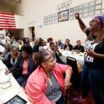 LaTosha Brown speaks to a crowd of women.