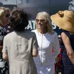 Kellyanne Conway, one of President Donald Trump's most influential and longest serving advisers, speaks with Education Secretary Betsy Devos, left, and Transportation Secretary Elaine Chao, second from left, at an event with First Lady Melania Trump, in front of the White House in Washington, Monday, Aug. 24, 2020. Conway announced Sunday that she would be leaving the White House at the end of the month, citing a need to spend time with her four children. (AP Photo/J. Scott Applewhite)