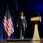 Kamala Harris walks toward a podium.