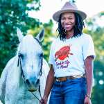 Caitlin Gooch poses with her horse, Goat.