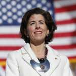 Gina Raimondo stands on the State House.