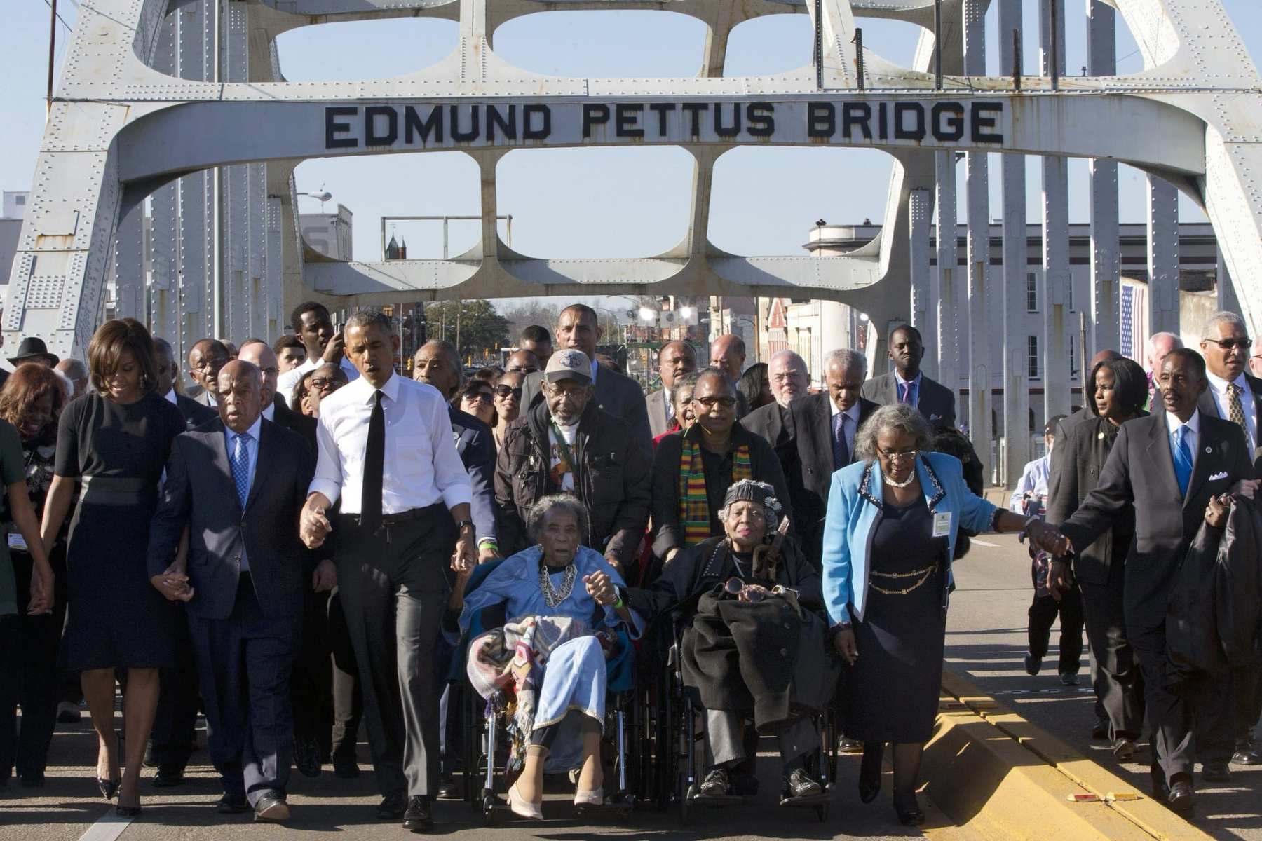 President Barack Obama walks over the Edmund Pettus Bridge with a group on the 50th anniversary of "Bloody Sunday"..