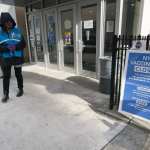 A person standing outside a close vaccination center.