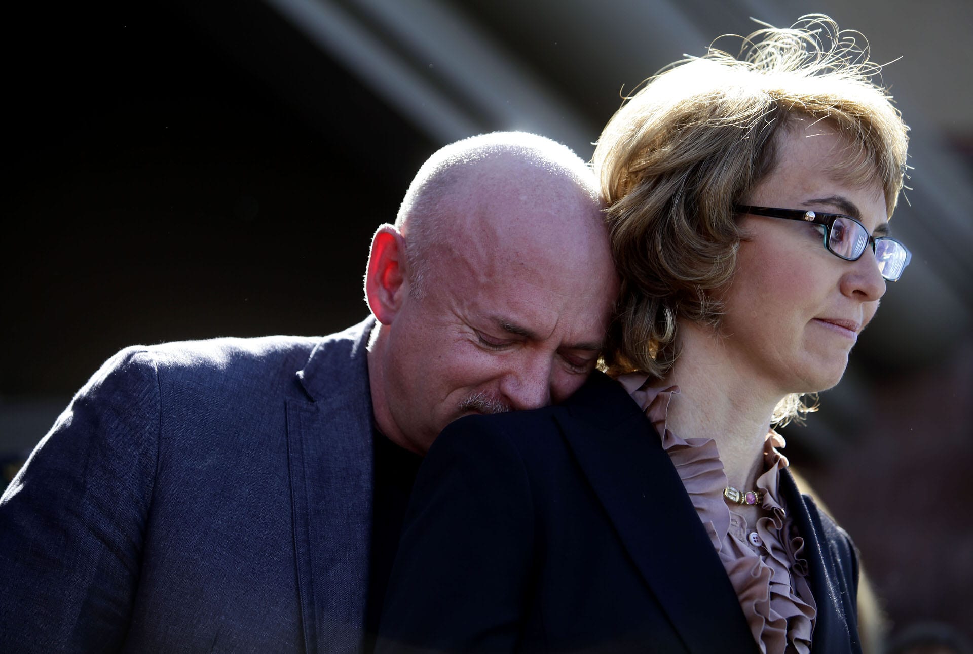 Mark Kelly leans his head on the shoulder of his wife and former Congresswoman Gabby Giffords.