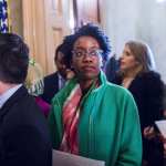 Rep. Lauren Underwood stands in the hallway at the Capitol.