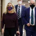 U.S. Rep. Marjorie Taylor Greene (R-GA) leaves her office walking with a group of people.