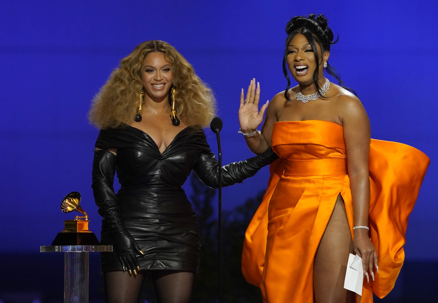 Beyonce, left, and Megan Thee Stallion accept the award for best rap song for "Savage" at the 63rd annual Grammy Awards .