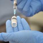 Nurse prepares a dose of Pfizer vaccine to be administered to patients.