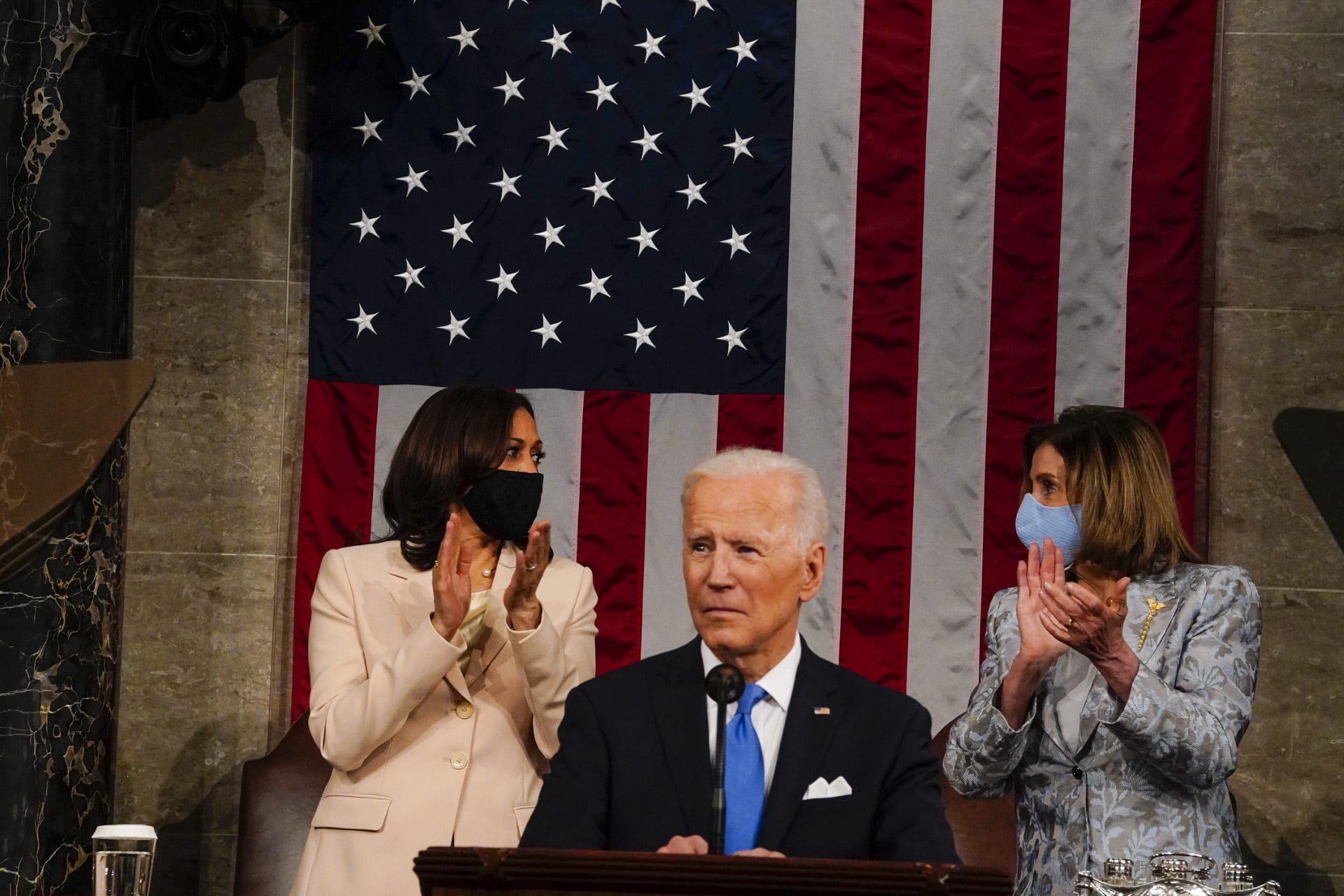 Harris and Pelosi stand behind Biden during speech