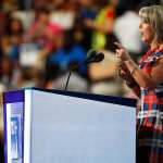 Gov. Michelle Lujan Grisham speaking at a podium.