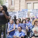 Representative Jasmine Crockett addresses the crowd at the For The People Rally in front of the Texas Capitol.