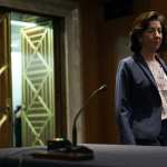 U.S. Secretary of Commerce Gina Raimondo walks into a hearing.