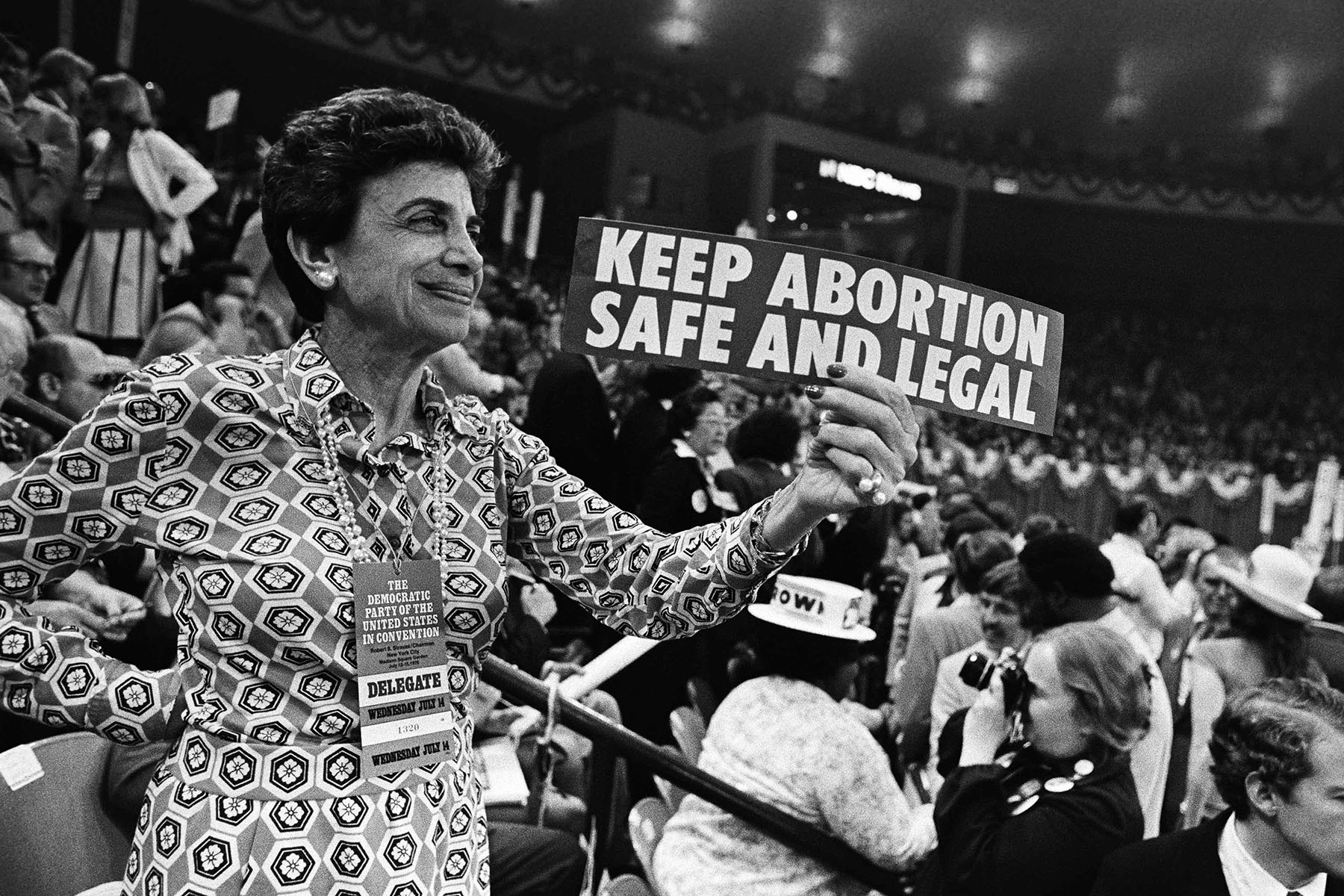 A woman holds up a pro-abortion sign during the Democratic National Convention.