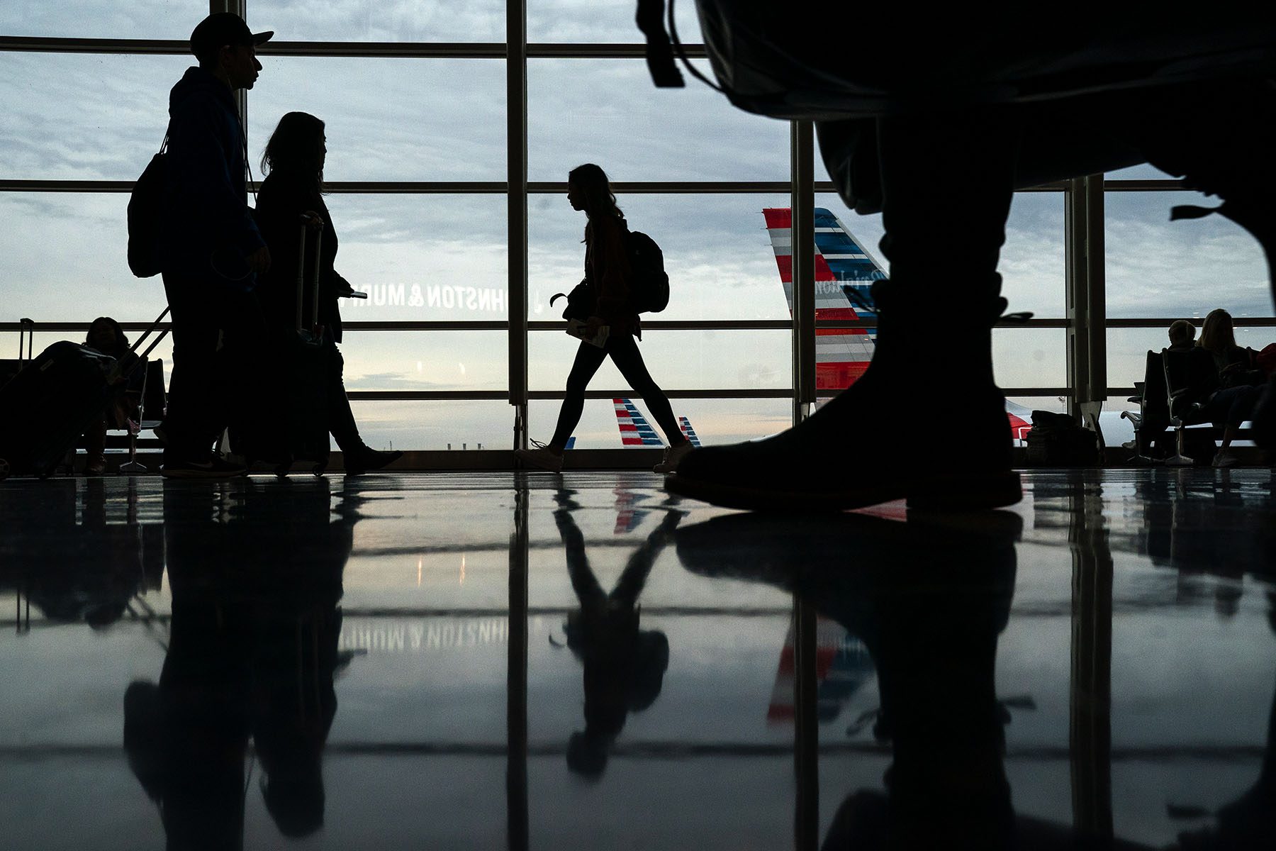 Passengers move through Ronald Reagan National Airport.