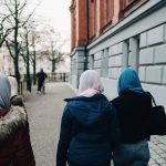 Rear view of girls wearing hijabs.