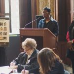 Natalie and Derrica Wilson speak during a presentation at Baltimore City Hall.