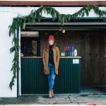 Caitlin Braam poses in front of her small business, Yonder Cider.