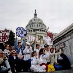 Demonstrators with the March for Women's Lives hold signs in front of the Capitol in 1989