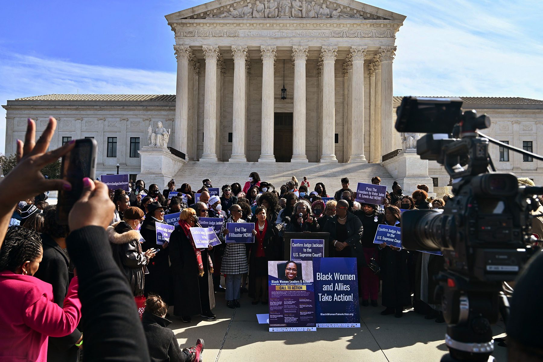 Activists hold a press conference in front of the U.S. Supreme Court. Signs read "Confirm Judge Jackson in the U.S. Supreme Court."