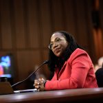 Ketanji Brown Jackson sits at a table in the Senate Judiciary hearing