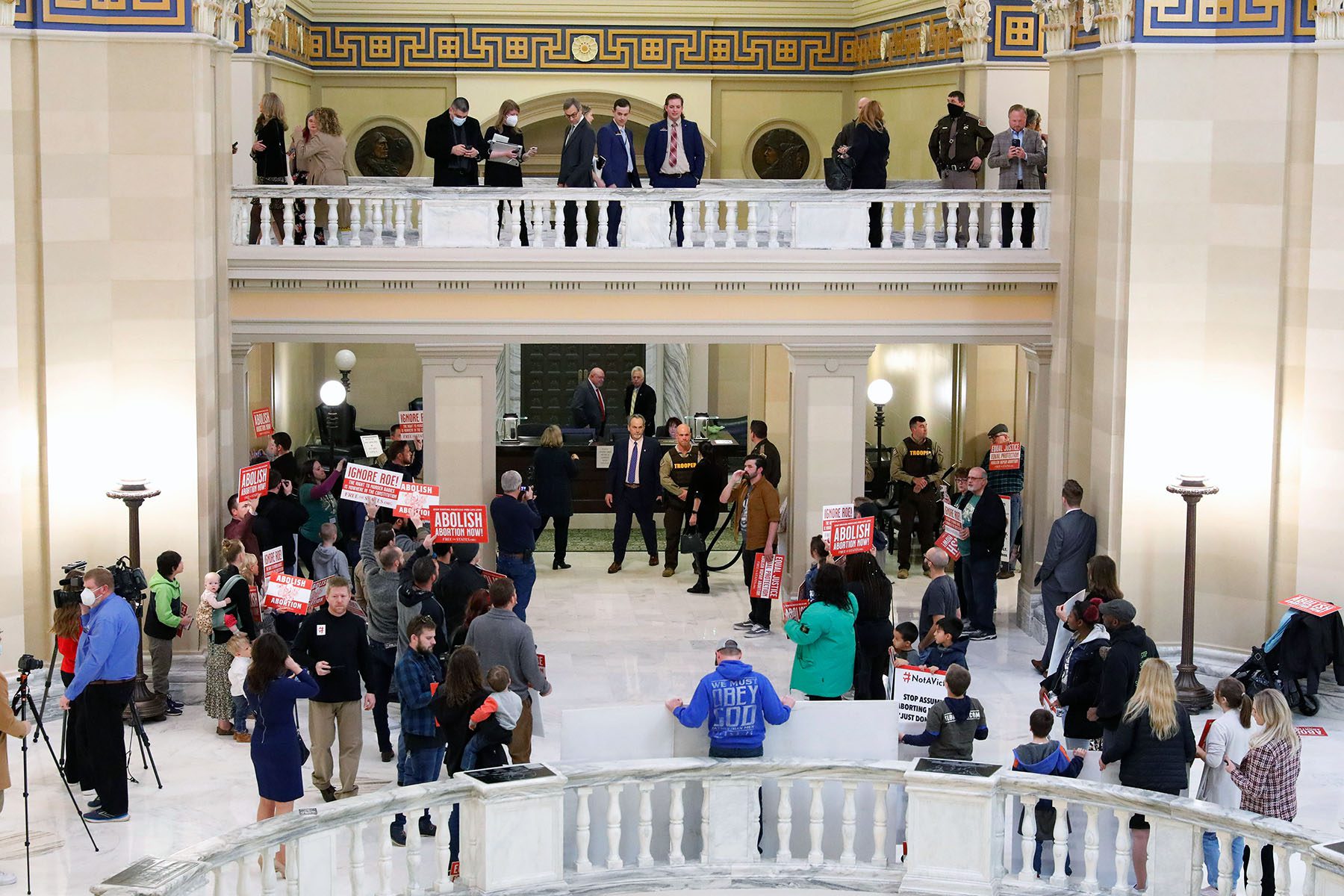 Anti-abortion protesters stand inside the Oklahoma Capitol.