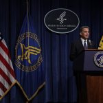 Xavier Becerra speaks from a podium during a news conference.