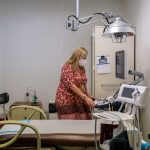 Julie Burkhart, co-owner of the Hope Clinic For Women, looks at an ultrasound machine inside an exam room.