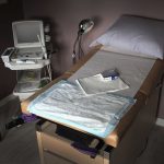 An ultrasound machine sits next to an exam table in an examination room at an Indiana abortion clinic.