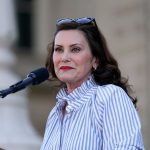 Gov. Gretchen Whitmer speaks to abortion-rights demonstrators utside the Michigan state capitol.