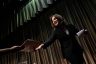 Kamala Harris is handed a folder as she exits the stage after speaking at a convention