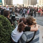 A child hugs their parent as abortion rights activists gather for a demonstration.