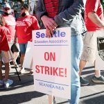 Teachers from Seattle Public Schools picket outside Roosevelt High School. A sign reads 