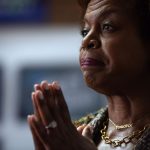 Cheri Beasley listens to constituents during a campaign event.