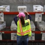 An election worker works at the Orange County Registrar of Voters.