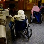 Residents in wheelchairs take a break at a Colorado nursing home.