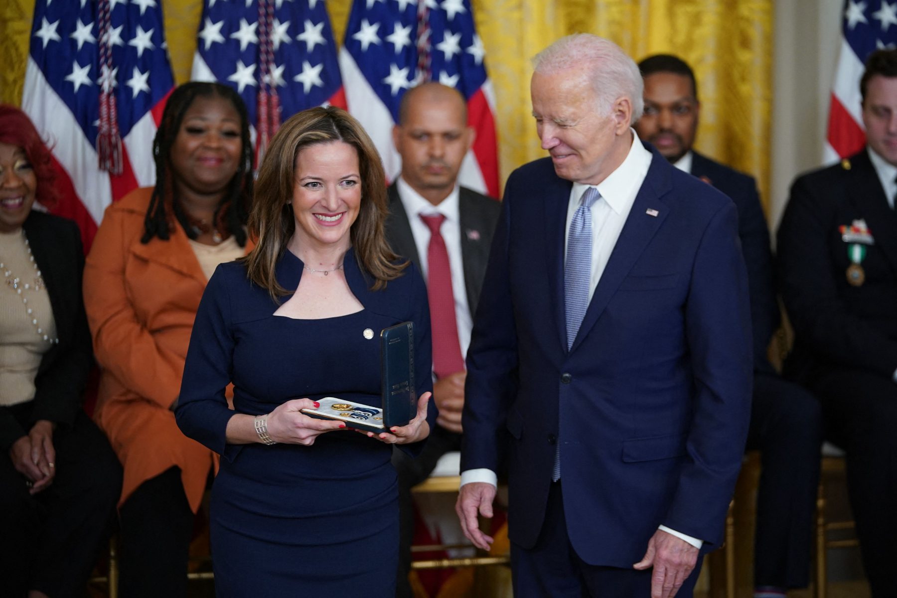 Jocelyn Benson, Michigan's secretary of state, receives the Presidential Citizens Medal from President Joe Biden for upholding the results of the 2020 presidential election despite pressure from President Donald Trump