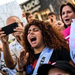 Abortion rights activists shout slogans as they rally in Miami, Florida.