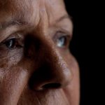 Close-up portrait of a woman looking away