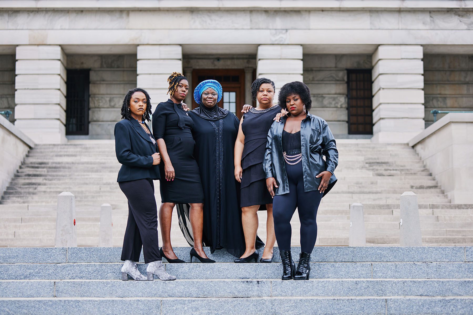 Zulfat Suara, Charlane Oliver, Delishia Porterfield, and Tequila Johnson are joined by Vanderbilt student and activist Kayla Prowell as they pose for a portrait on the steps of the Tennessee State Capitol.