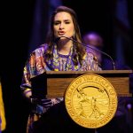 Peggy Flanagan delivers a speech from a podium after being sworn in.