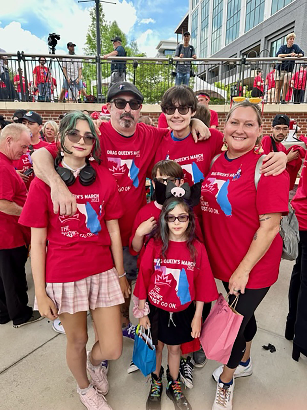 The Cousins pose for a picture together at the Drag Queen March.