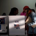 People vote at a polling location in Columbus, Ohio on November 8, 2022.