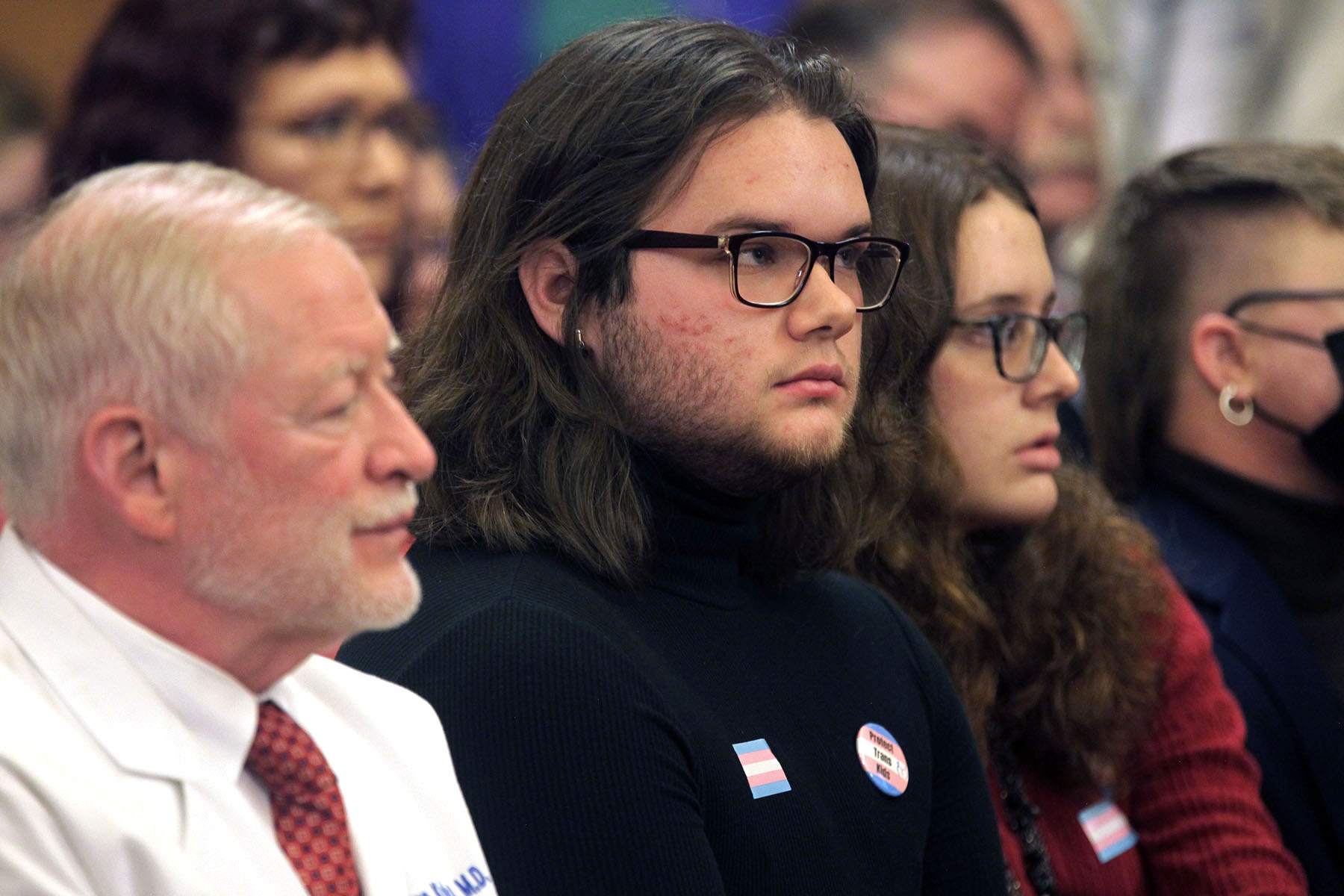 Adam Kellogg, a transgender man, follows a Kansas Senate health committee hearing at the Kansas State Capitol in Topeka, Kansas.