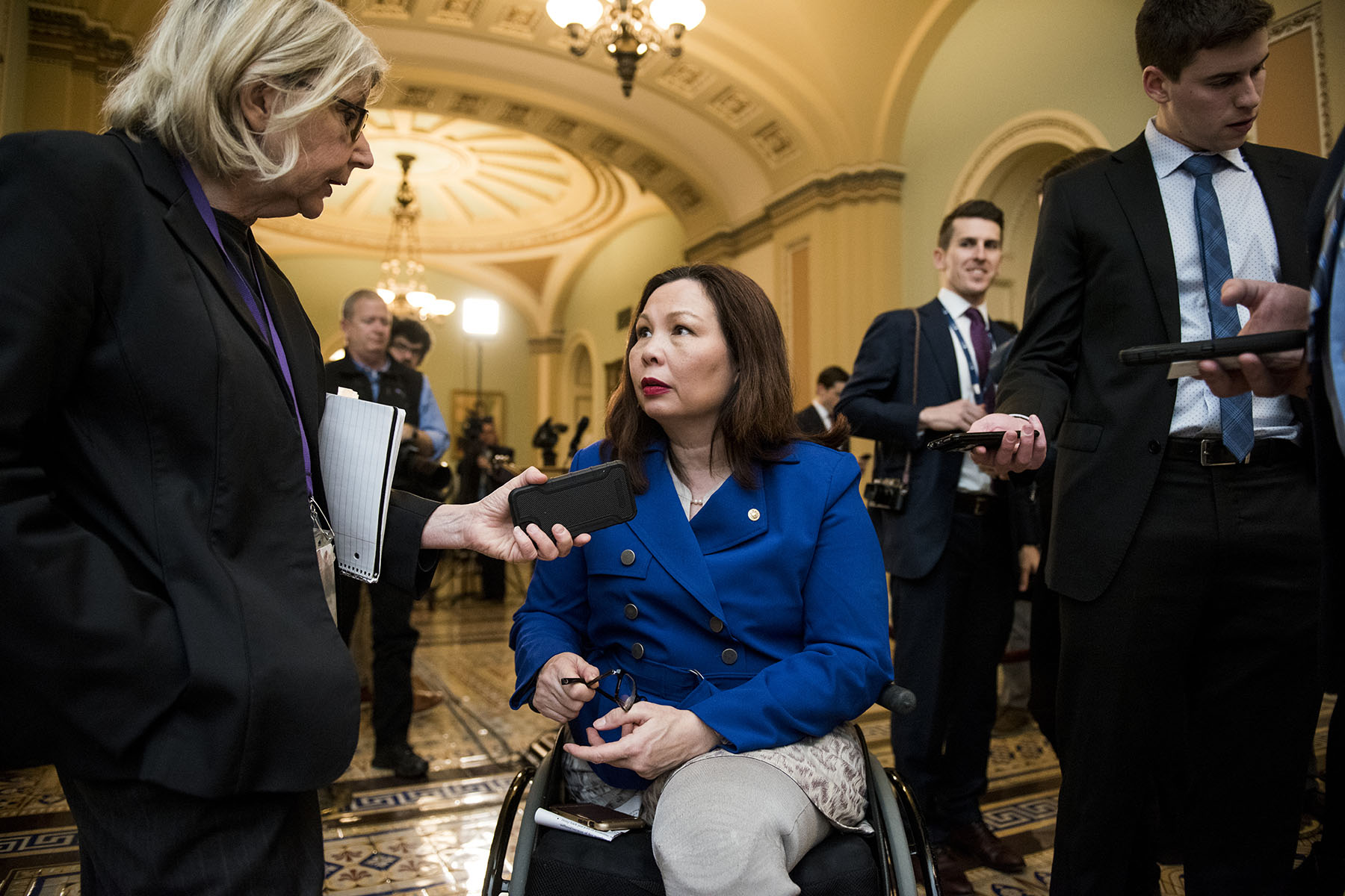 Tammy Duckworth speaks to members of the press on Capitol Hill.