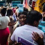 Harvard students Nahla Owens and Kashish Bastola hug outside the Supreme Court.