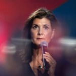 Republican U.S. presidential candidate Nikki Haley holds a microphone at an event.