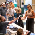 Voters receive their ballots as they vote on Ohio Issue 1 during a special one-issue election.