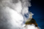 Steam from an exhaust vent on the east front of the U.S. Capitol complex partially obscures the dome.