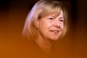 Sen. Tammy Baldwin smiles as she speaks during an interview on Capitol Hill.