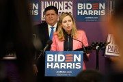 Former Congresswoman Debbie Mucarsel-Powell speaks at a podium during an event.